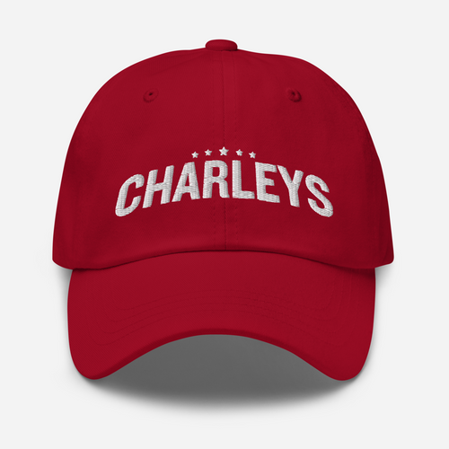 Classic dad hat with red fabric and white thread that says 