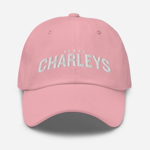 Classic dad hat with light pink fabric and white thread that says 
